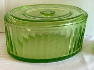 lot 25 image: Green Depression Glass Measuring Cup, Covered Glass Dish and Pink Depression Covered Butter Dish