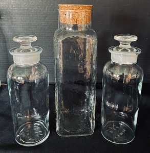 lot 337 image: Lidded Glass Vessel Grouping including Decorative Jars