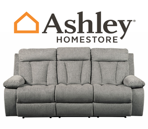 lot 21 image: Brand New Factory Sealed Ashley Furniture Mitchiner Fog Reclining Sofa