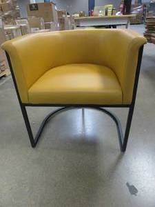lot 545 image: Manhattan Comfort  Bali Saddle and Black Faux Leather Dining Chair (OUT OF BOX, SMALL TEAR IN LEFT ARM)