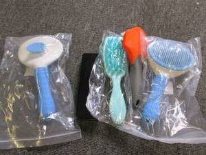 lot of pet brushes...