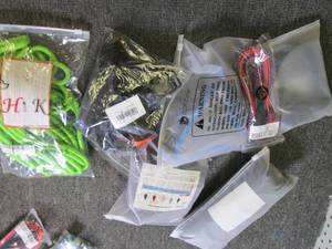 lot of dog harnesses, leashes , dog...