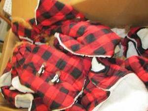 box of dog overstock clothes...