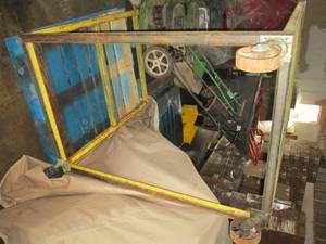beige metal cart missing 1 wheel...