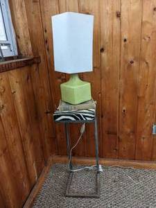 lot 36 image: Table Lamp, Zebra Striped C-Shaped End Table, and American Short Stories Classics Book