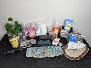 lot 88 image: A Variety of Bathroom Items Including a Curling Iron, Candles, Bubble Bath and More