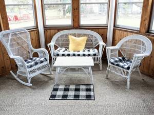 lot 1 image: Matching White Wicker Set includes Couch, Chair, Rocking Chair, Coffee Table, Cushions and Rug