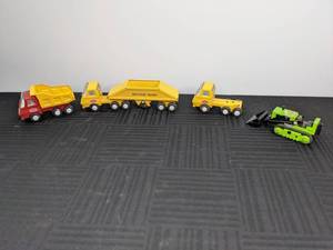 lot 15 image: Vintage Tonka Semi Truck, Semi Truck with Bottom Dump Trailer, Dump Truck and Green Bulldozer Toys