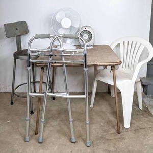 lot 113 image: Holmes Space Heater, Oscillating Table Fan, Vintage Folding Table, Industrial-Style Stool, White Plastic Chair, and Walker