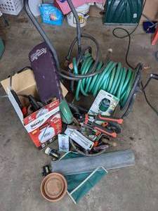 lot 142 image: Assorted Lawn Care Items Hose Cart, Multi-Purpose Sprayer, Garden Tools and More