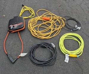 lot 148 image: Retractomatic 30 Heavy-Duty Retractable Cord Reel and Various Extension Cords
