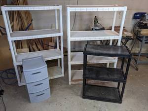 lot 64 image: Set of Two 4-Shelf Shelving Unit, Black 3-Shelf Shelving Unit and Gray 3-Drawer Storage Container
