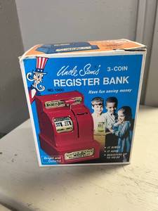 lot 231 image: Uncle Sams Register Toy Bank