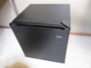 lot 69 image: Haier mini dorm sized refrigerator.
