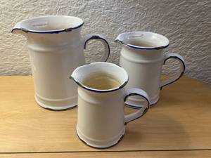 lot 46 image: Set of 3 White Pitchers