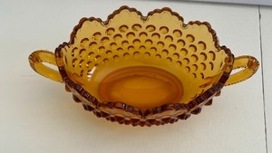 lot 27 image: Amber Glass Fenton Hobnail Handled Dish