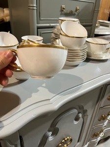 lot 56 image: Limoges Gold & White Large Set of Teacups & Saucers