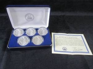 lot 22 image: Set of 5 Morgan Silver Dollars in D...