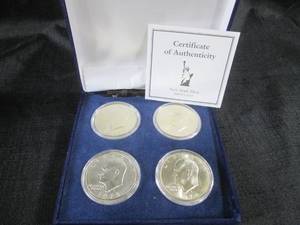 lot 23 image: Set of 4 Eisenhower One Dollar Coin...