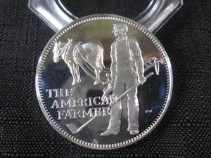 lot 199 image: The American Farmer Sterling Silver...
