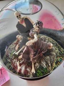 lot 27 image: Globe With Mummy Man & Woman Dancing On Stand