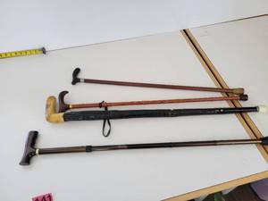 lot 141 image: Four Walking Canes With Hand Gripping Handles