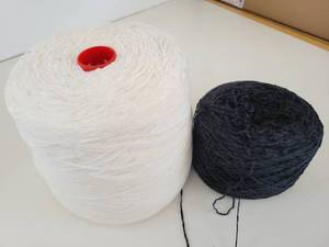 lot 148 image: White & Black Skeins Of Yarn