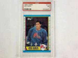 lot 27 image: Joe Sakic Rookie 1989 Topps No. 113 PSA Graded NM 7