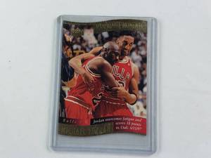 lot 140 image: Michael Jordan Upper Deck Memorable Moments Overcoming Fatigue, Leaning on Pippen. 1 of 10