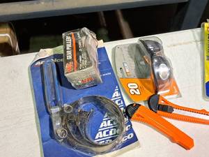 lot 530 image: Lot of (5) Hand Tools - ACDelco Filter Wrench, NASCAR #20 Sunglasses, MIT Gear Puller, Two Box Cutters