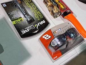 lot 540 image: Lot of (5) Hand ToolsAccessories - NuFlare Flashlight, Camo Flashlight, NASCAR #8 Sunglasses, Flashlight, Box Cutter