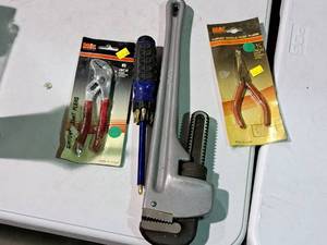lot 544 image: Lot of (4) Hand Tools - MIT 6 Groove Joint Pliers, Pipe Wrench, Multi-bit Screwdriver, MIT curved Needle Nose Pliers