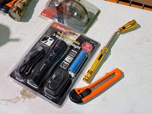 lot 541 image: Lot of (4) Hand ToolsAccessories - AmPro Rechargeable Flashlight, Box Cutter, Angle Flashlight, NASCAR #9 Sunglasses