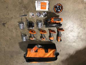 lot 21 image: RIDGID  18V Cordless 5-Tool Combo Kit with 3 Batteries and Charger by RIDGID  Customer Returns See Pictures