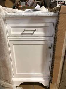 lot 49 image: Windlowe 24 in. W x 22 in. D x 35 in. H Bath Vanity in White with Carrera Marble Vanity Top in White with White Sink by Home Decorators Collection  Customers Returns See Pictures