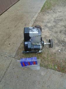 Briggs & Stratton 12.5 hp vertical shaft motor with eletric start. Appears to be stuck. As shown.