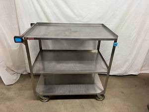 lot 57 image: MSRP $1800 Lakeside Mfg Imperial Heavy Duty Stainless Steel 3-Shelf Storage Cart With 3 Sided Guard Rail On Top 2 Shelves - Great Rolling Condition