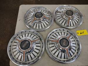 lot 611 image: (4) 1964 Chevy Malibu SS Hub Caps, ...