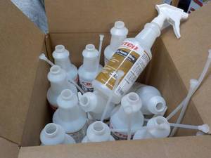 lot 91 image: box of 12 empty spray bottles.