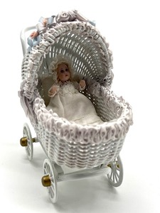 lot 98 image: Vintage Dollhouse Barbara J. Rumeli Wicker Baby Carriage and Miniature Doll