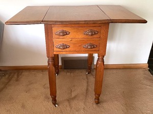 lot 9 image: Antique Victorian Walnut Drop Leaf Sewing Table on Casters