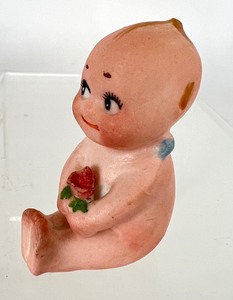 lot 193 image: Antique Kewpie Doll Holding a Rose