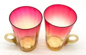 lot 275 image: Pair of Antique Amberina Cups with Handles
