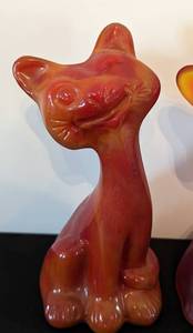 lot 196 image: Pair of Fenton Amberina Satin and Slag Glass Happy Cats