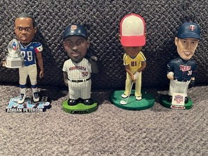 lot 48 image: Bobblehead Collection featuring Minnesota Vikings Adrian Peterson and Tiger Woods