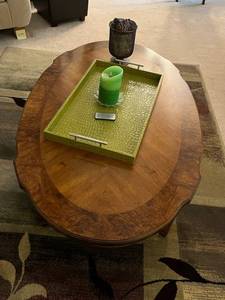 lot 211 image: Oval Solid Wood Coffee Table with Accent Tray, Luminara Candle, and Dcor