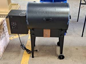 lot 748 image: Traeger Tailgater Pellet Grill Titos Handmade Vodka Grill (in box)