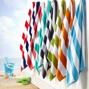 lot 194 image: Brand New FreshFolds Superior Cabana 4-Pc. Beach Towel Set ((MSRP $74.99))