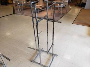 lot 40 image: Lot of 3 Adjustable Height 4 Way Racks, No Wheels Includes 4 Mid Risers Each