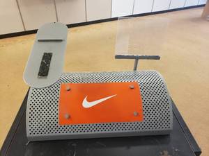 lot 143 image: Shoe Display with Nike Logo